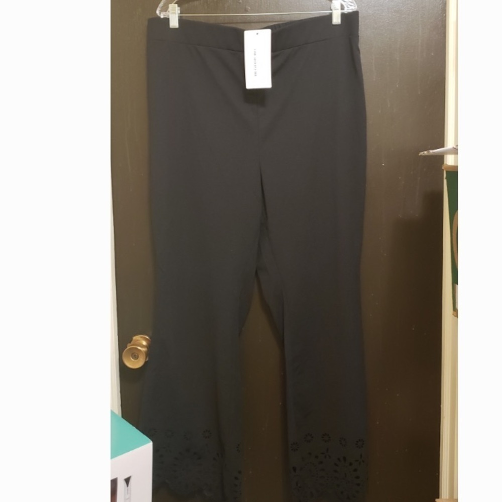 Women black pants with beautiful swirl hole detail at the bottom
